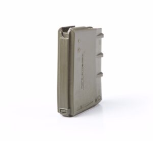 Olive green rifle magazine standing upright.