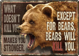 Roaring bear with humorous warning sign.