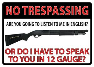 No trespassing sign with shotgun illustration.