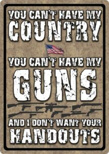 Patriotic sign about country, guns, and handouts.
