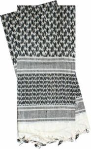 Black and white patterned scarf with fringes.