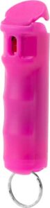 Pink pepper spray keychain for personal safety.
