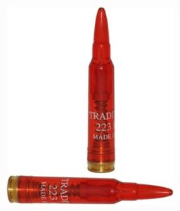 Two red .223 dummy rounds, side and upright view.
