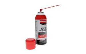 Gun scrubber spray can with red cap detached.