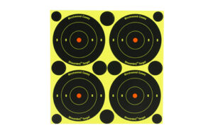 Four circular shooting targets on yellow background