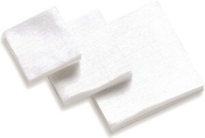 White square gauze pads stacked neatly