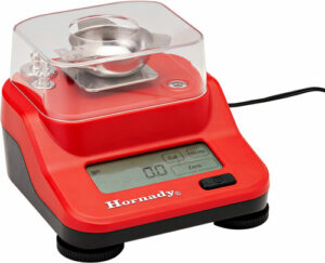 Digital reloading scale with red base and LCD display.