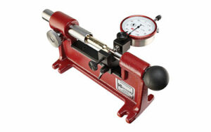 Red dial indicator tool on white background