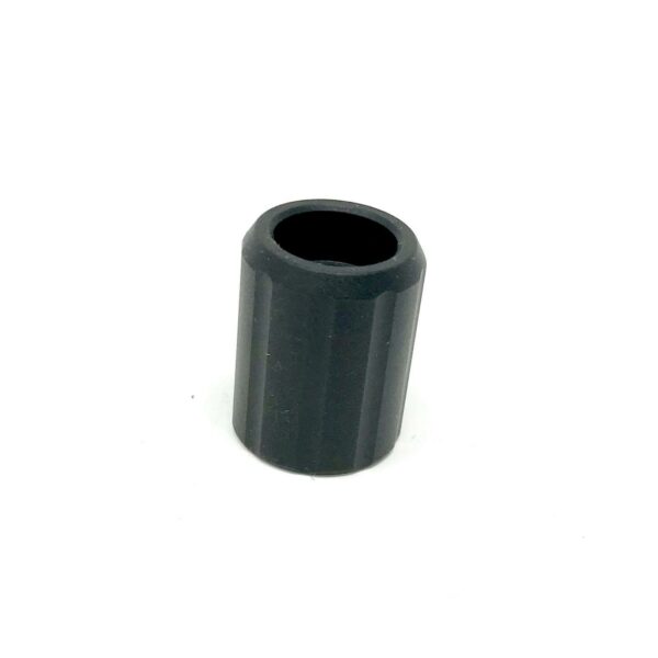 Black plastic cylindrical spacer, isolated on white background.