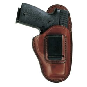 Gun in brown leather holster with clip