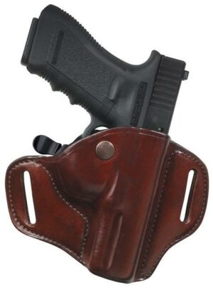 Pistol in leather holster, side view