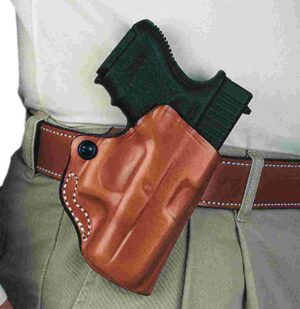 Holstered handgun on belt