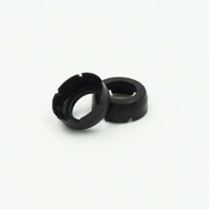 Two black rubber grommets on white background.