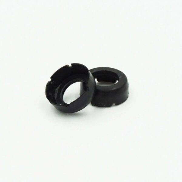 Two black rubber grommets on white background.