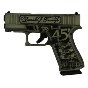 Decorative handgun with engraved design and text.