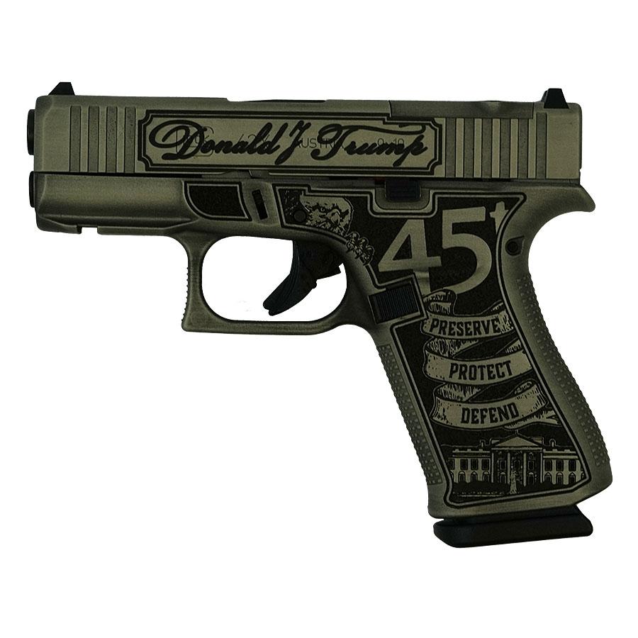 Decorative handgun with engraved design and text.