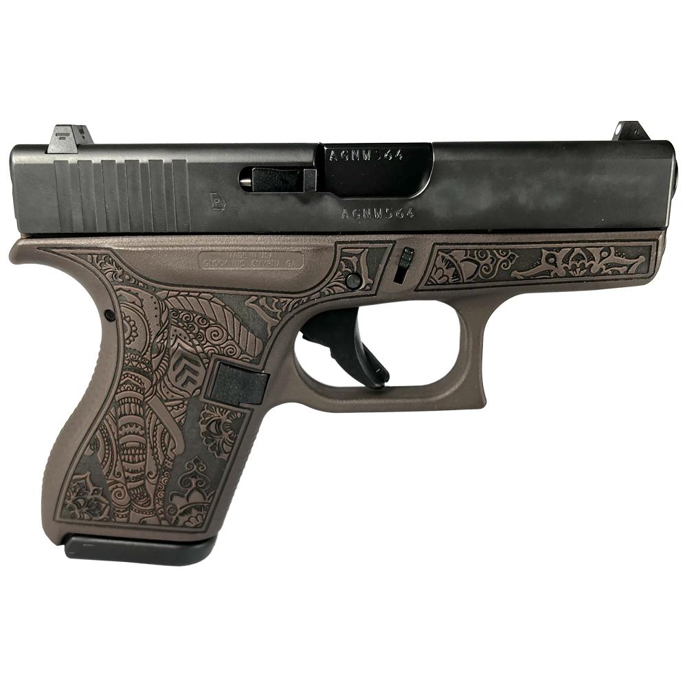 Decorative engraved handgun side view