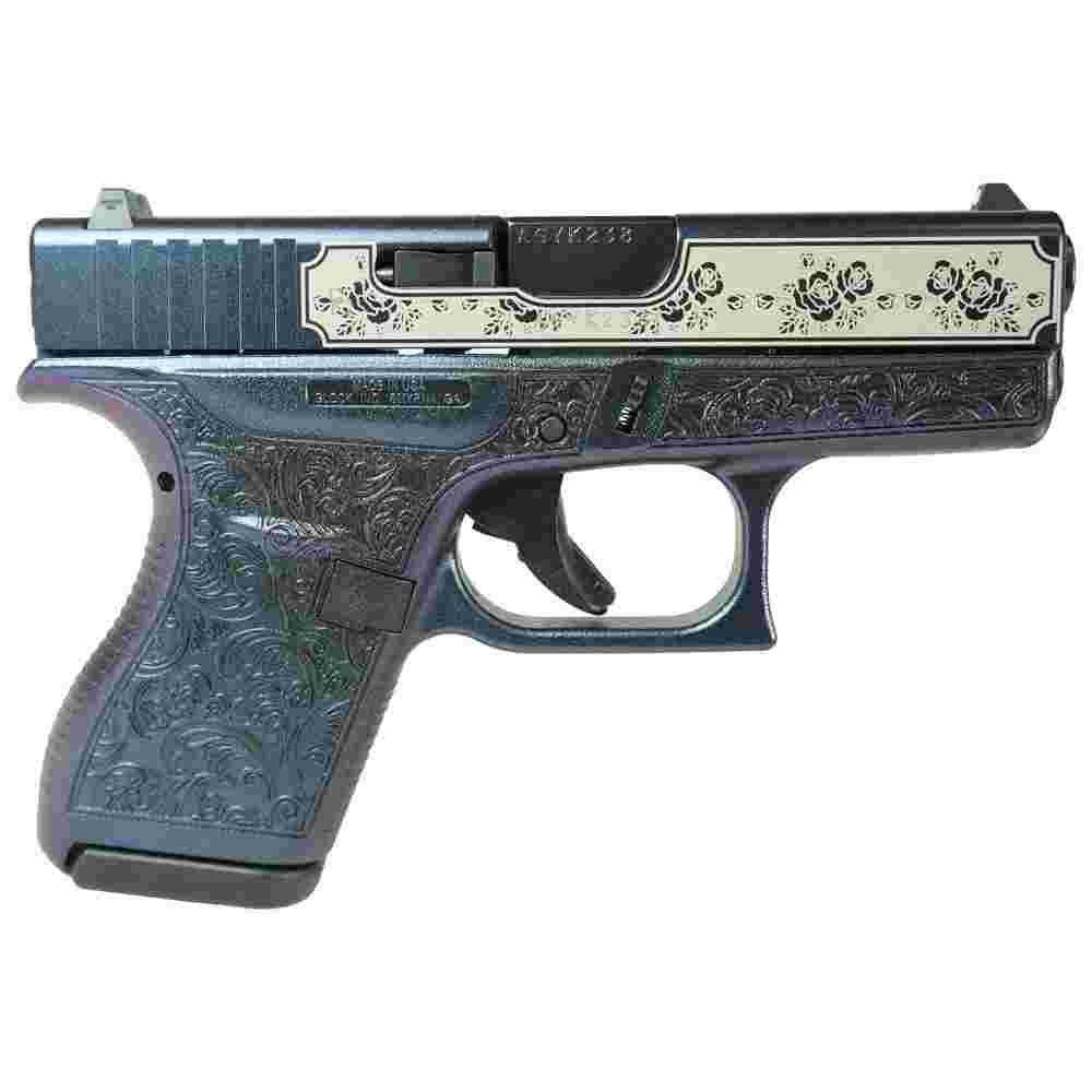Ornately engraved handgun with floral design