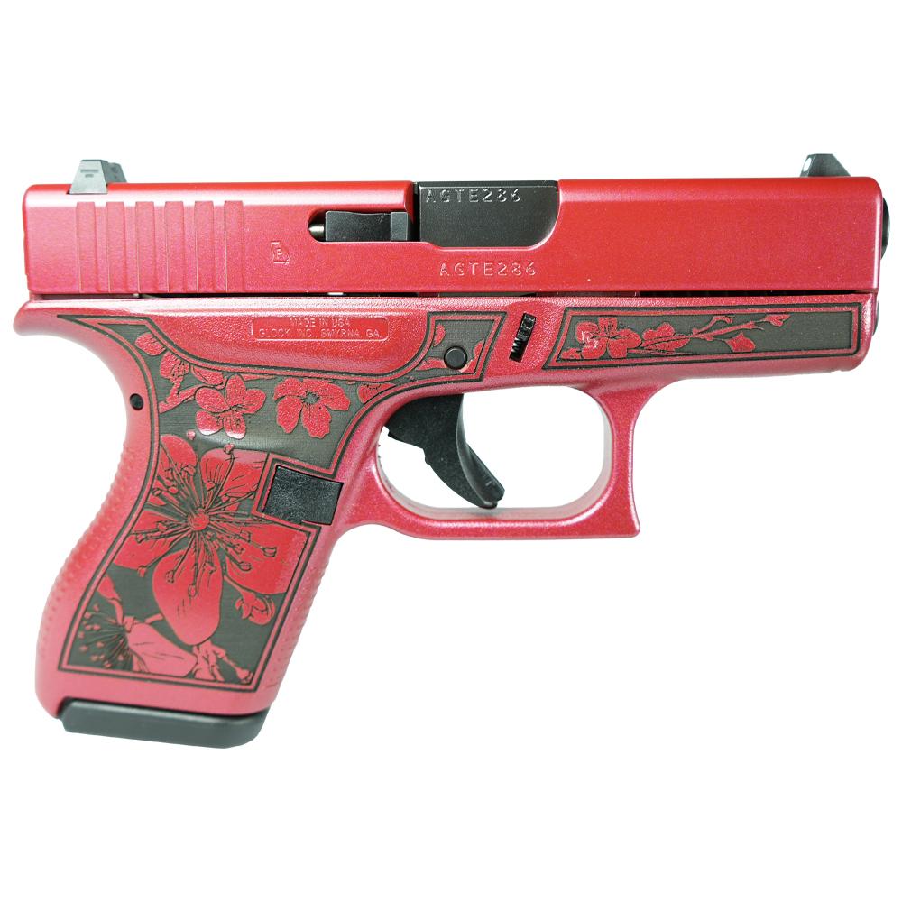 Red pistol with floral patterns and black accents.