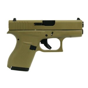 Tan handgun side view on white background.