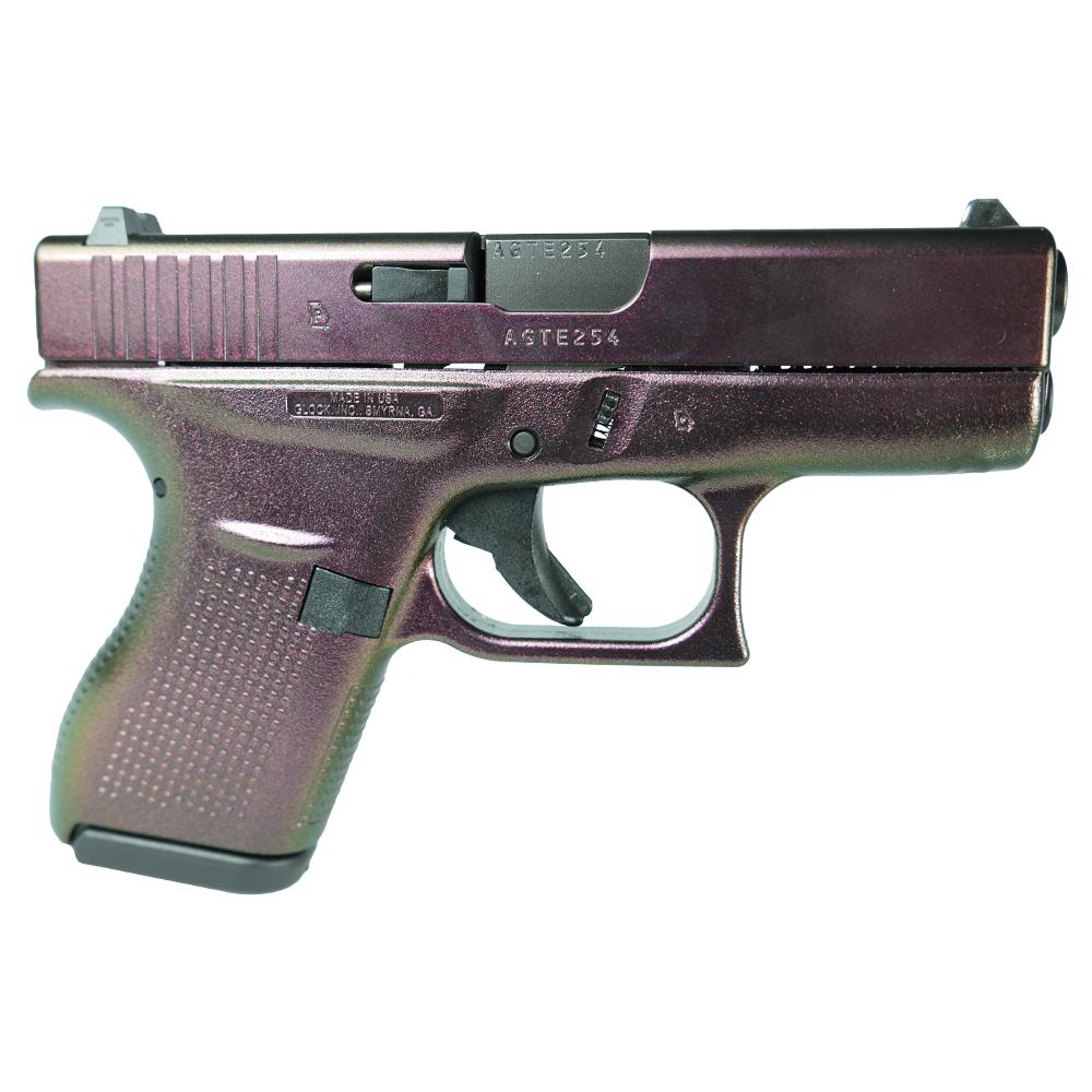 Purple handgun side view with safety features