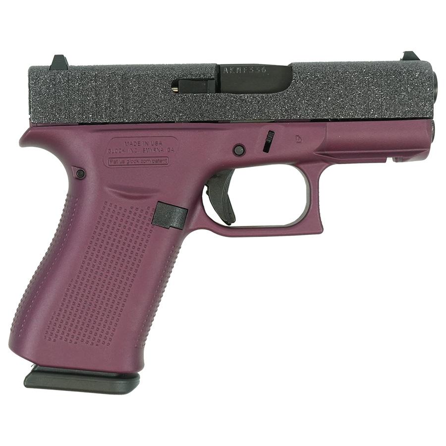 Purple handgun with textured grip and slide.