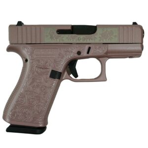 Ornate engraved handgun with floral design