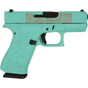 Teal decorated handgun with floral engravings