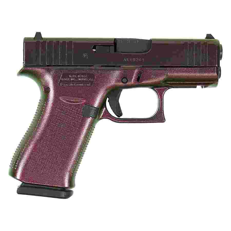 Side view of a handgun on white background.