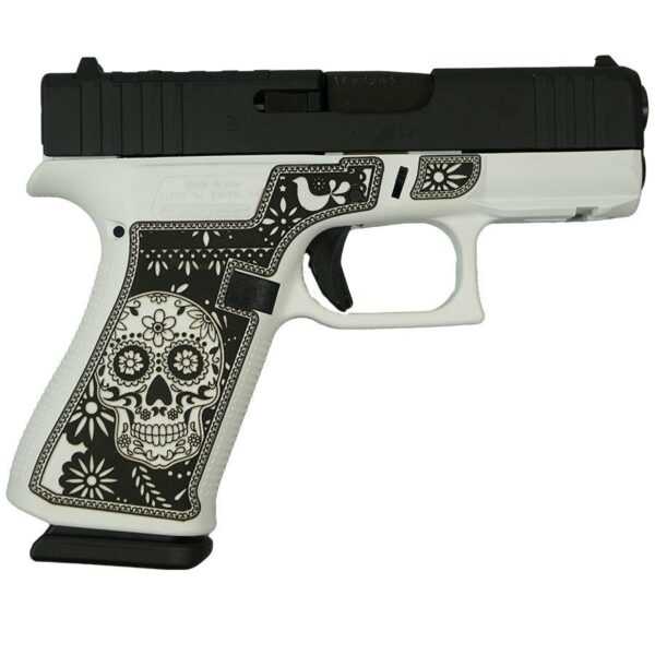 Decorative gun with skull and floral pattern.