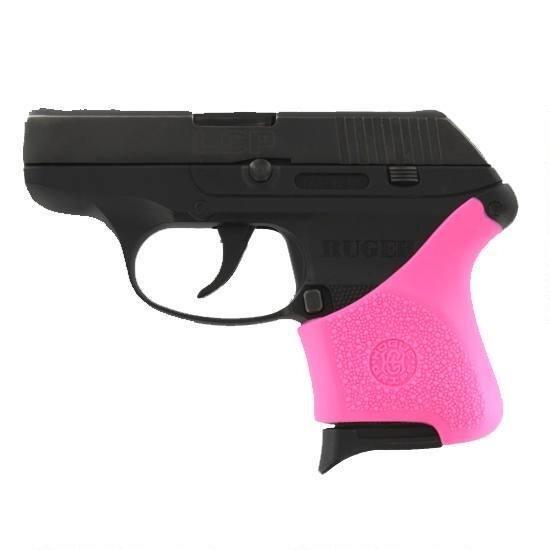 Black handgun with pink grip detail.