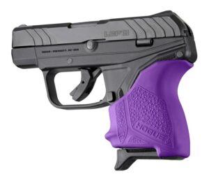 Black handgun with purple grip on white background.