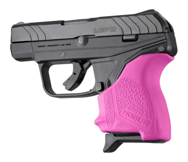 Black handgun with pink grip