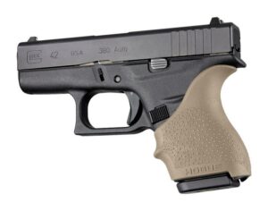 Black handgun with tan grip, side view.