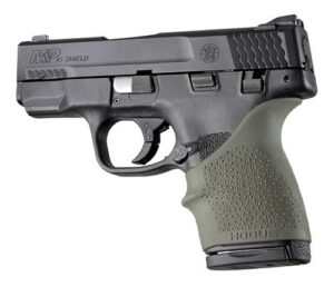 Black compact handgun with textured grip
