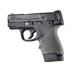 Black handgun with textured grip on white background.