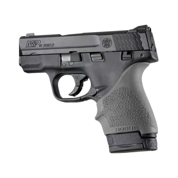Black handgun with textured grip on white background.