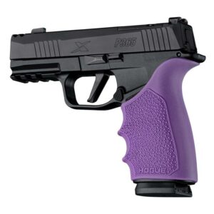 Handgun with purple grip on white background.