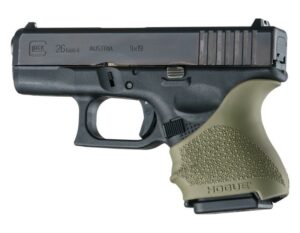 Handgun with textured grip and slide.