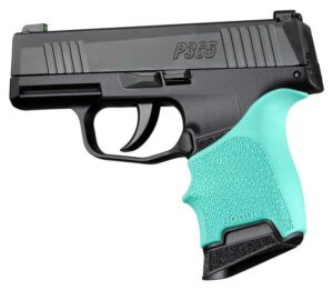 Black handgun with mint green grip