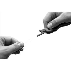 Hands using tool for precise adjustment