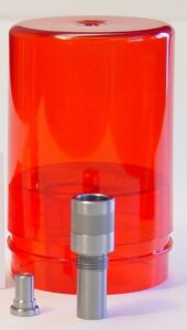 Red plastic cover with two metal components.