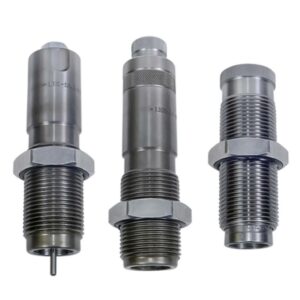 Three metal reloading dies for ammunition.