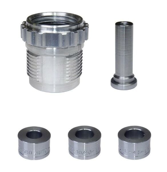 Silver die set with various components.