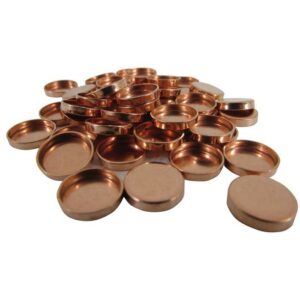 Stack of copper washers on white background.