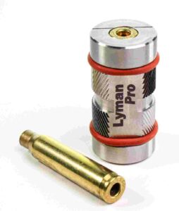 Lyman Pro reloading tool with brass cartridge case.