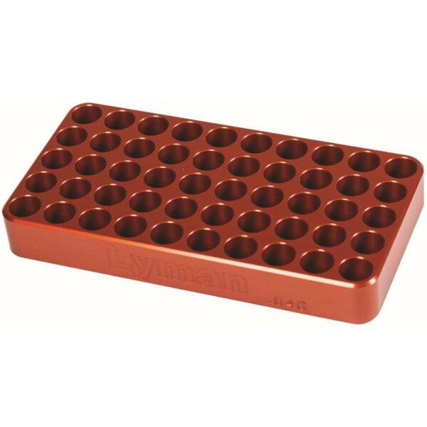 Orange Lyman reloading block with multiple holes.