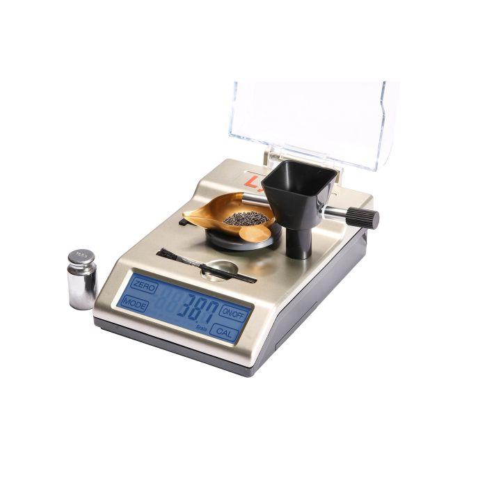 Digital grain scale with display and accessories.