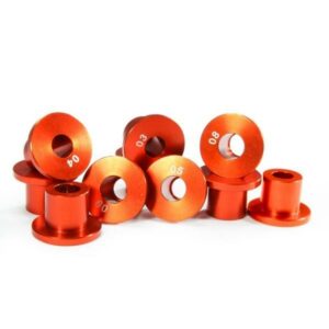 Red aluminum bushings on white background