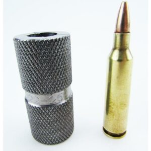 Bullet next to metal tool gauge